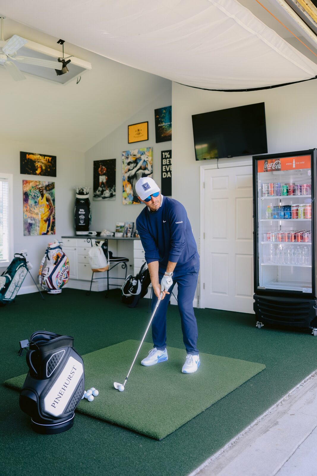 Billy Belair demonstrating a swing inside the Pinseekers Lab