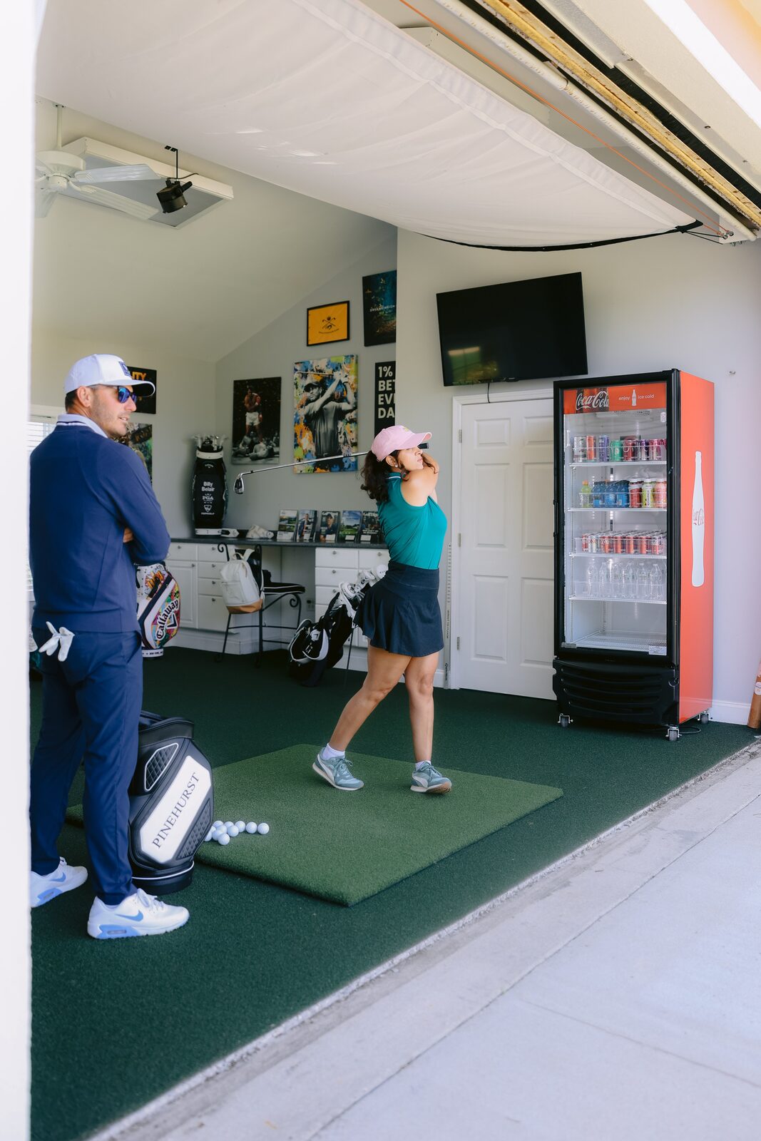 Billy Belair coaching a student through a swing in the Pinseekers Lab